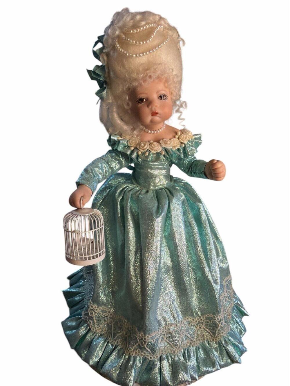 Doll 9” vintage-style collectible doll depicts a woman, likely inspired by Marie